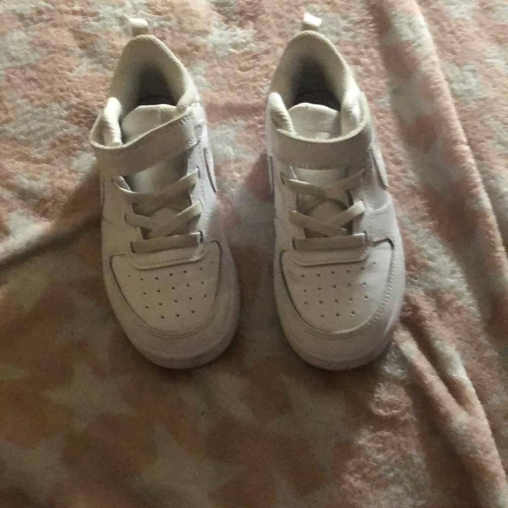 Kids white Nike shoes